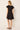 V-neck and flutter sleeved black mini dress