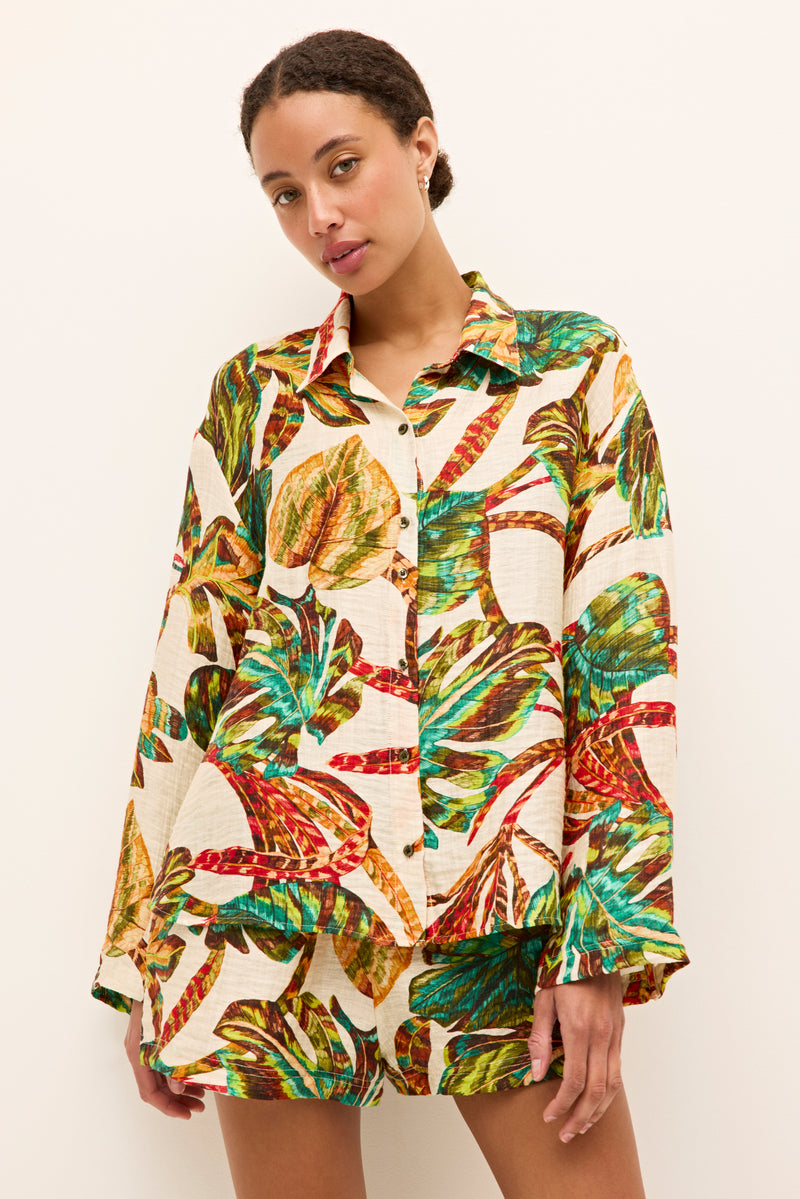 Casual linen blend shirt with vibrant tropical print on a bream background 