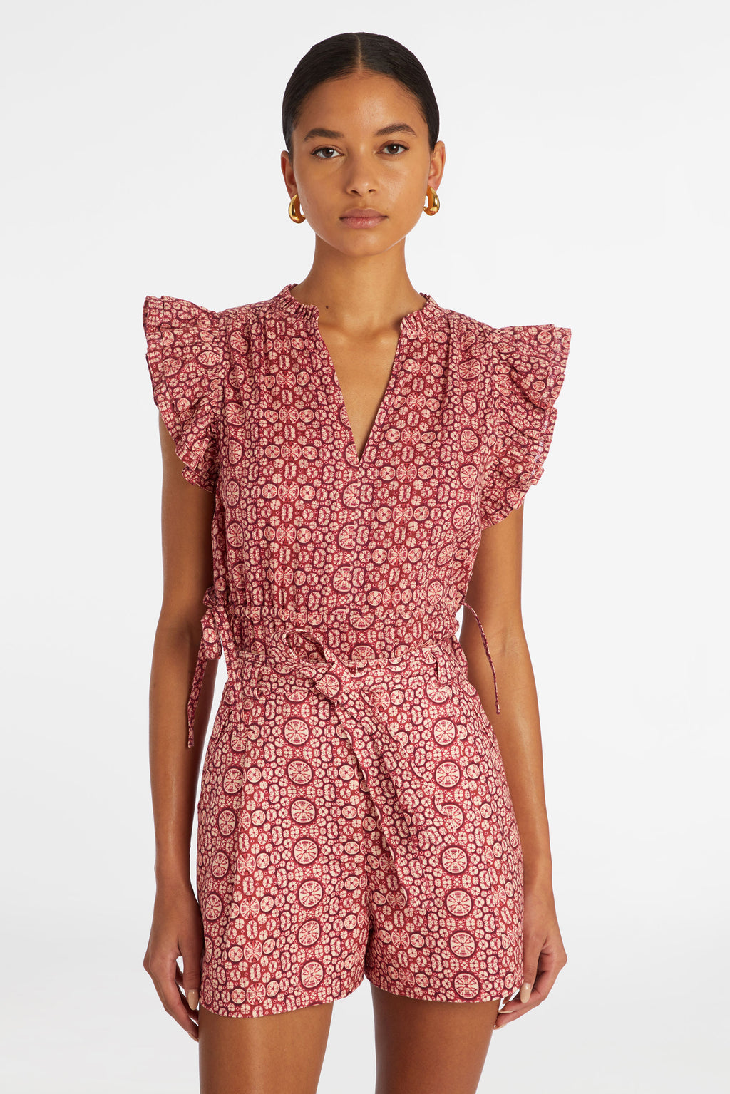 Short sleeve top with a ruffled v-neckline and ruffled short sleeves