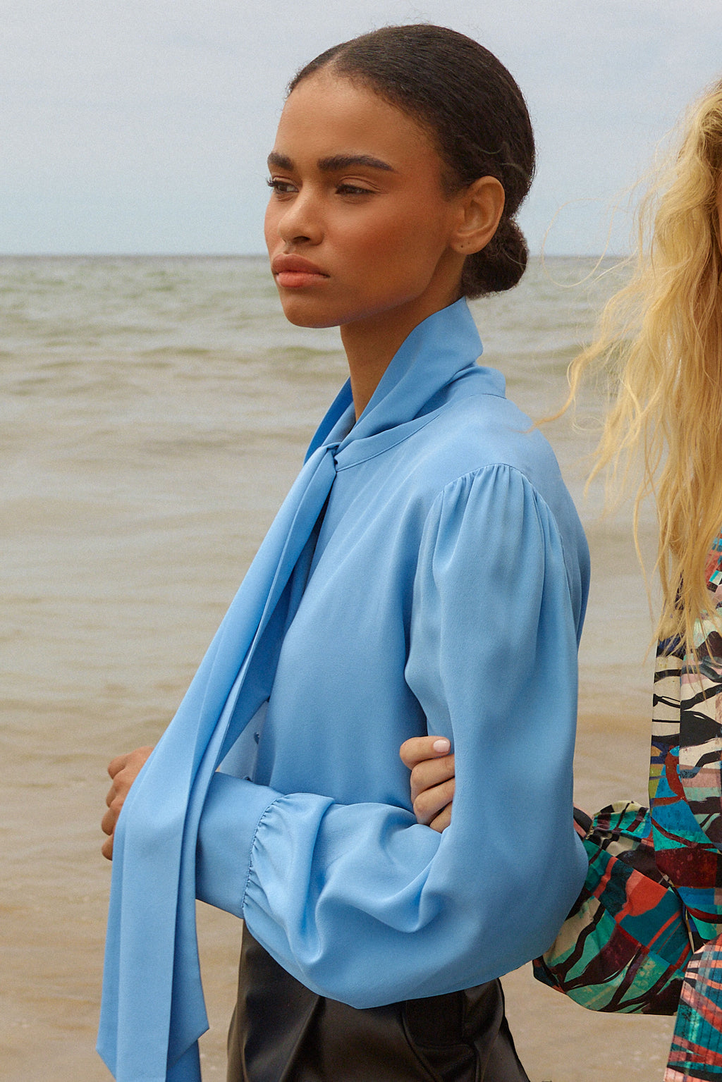 Blue long sleeve blouse with large bow, button closure and, button cuffs