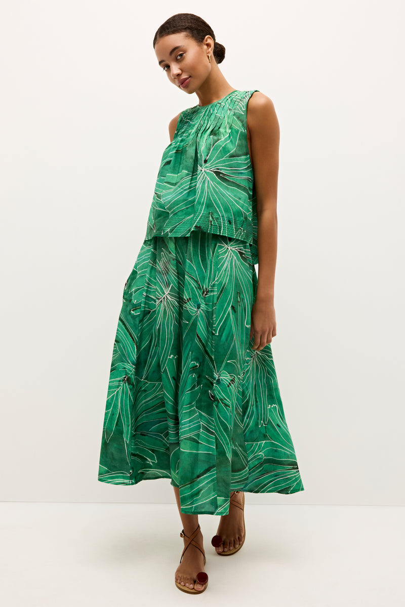 Flowy, cropped top with leaf inspired graphics and a round neckline