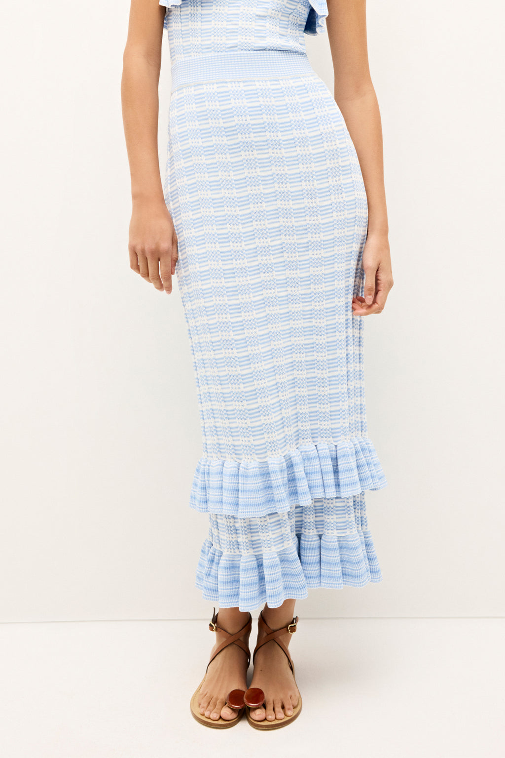 Textured body con skirt in soft blue with layered ruffles 
