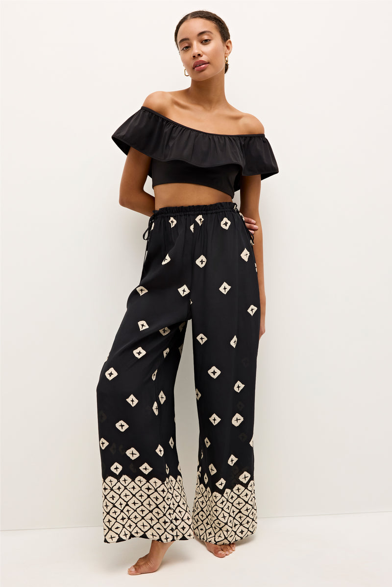 Black wide leg pants with geometric ivory print and contrasting hem detail 