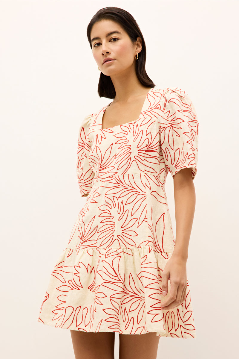 Short puff sleeve mini dress with red tropical leaf print on a cream background 