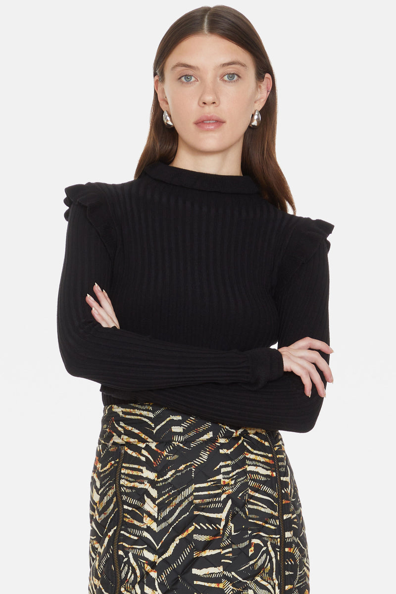 Black ribbed turtleneck with ruffles on the shoulders and neck