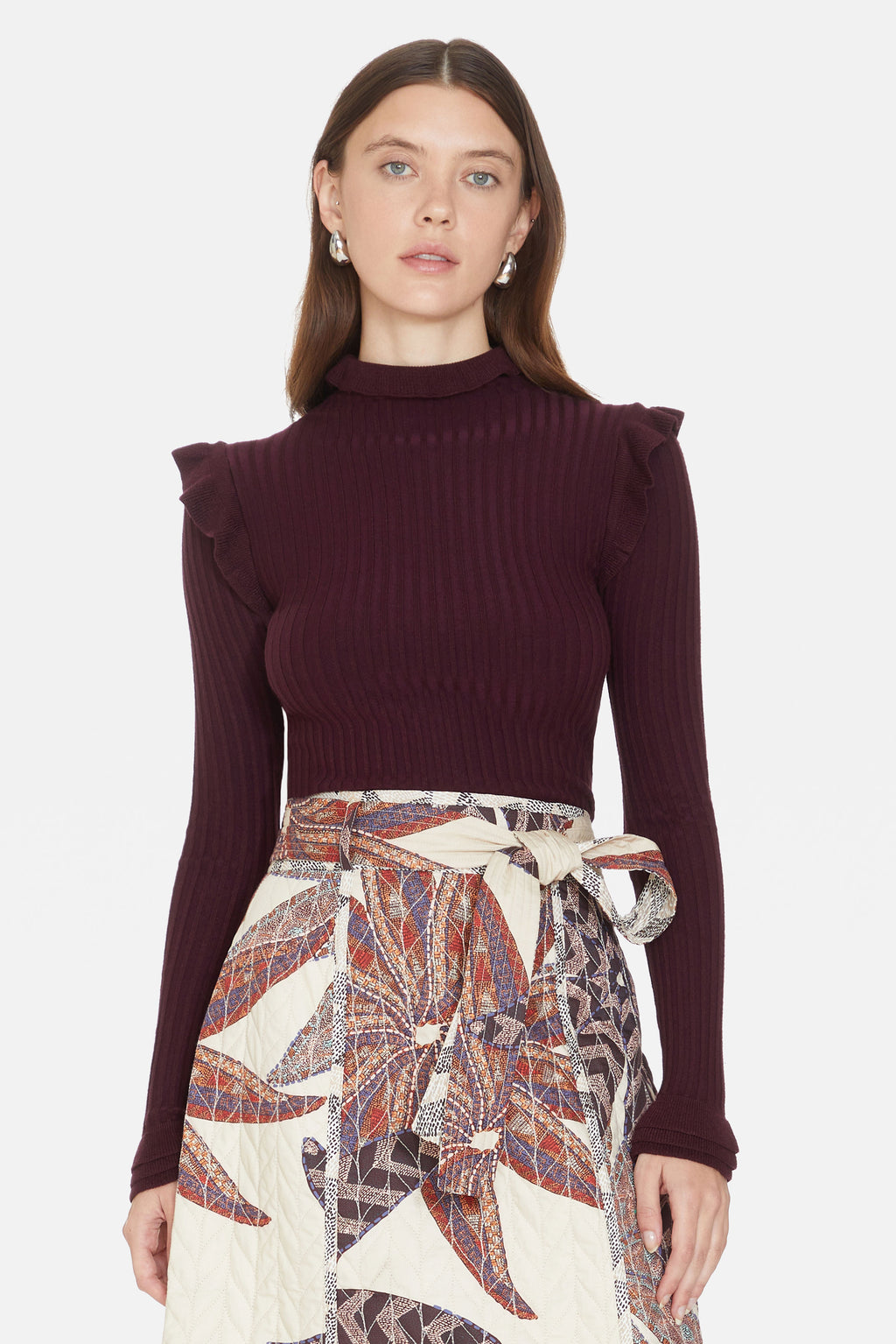Deep purple turtleneck with ruffle details on shoulders and neck