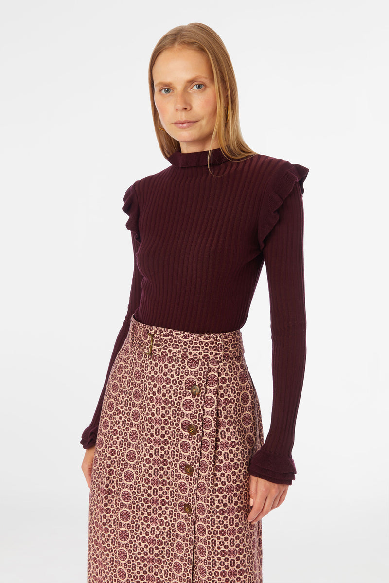 Red and tan geometric patterned high-waisted column skirt with top stitch details and slash pockets