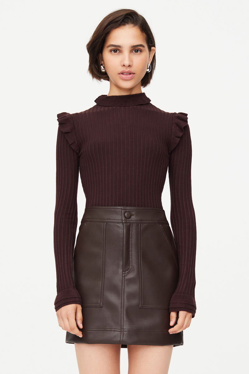 Brown ribbed turtleneck with ruffles on the shoulders and neck