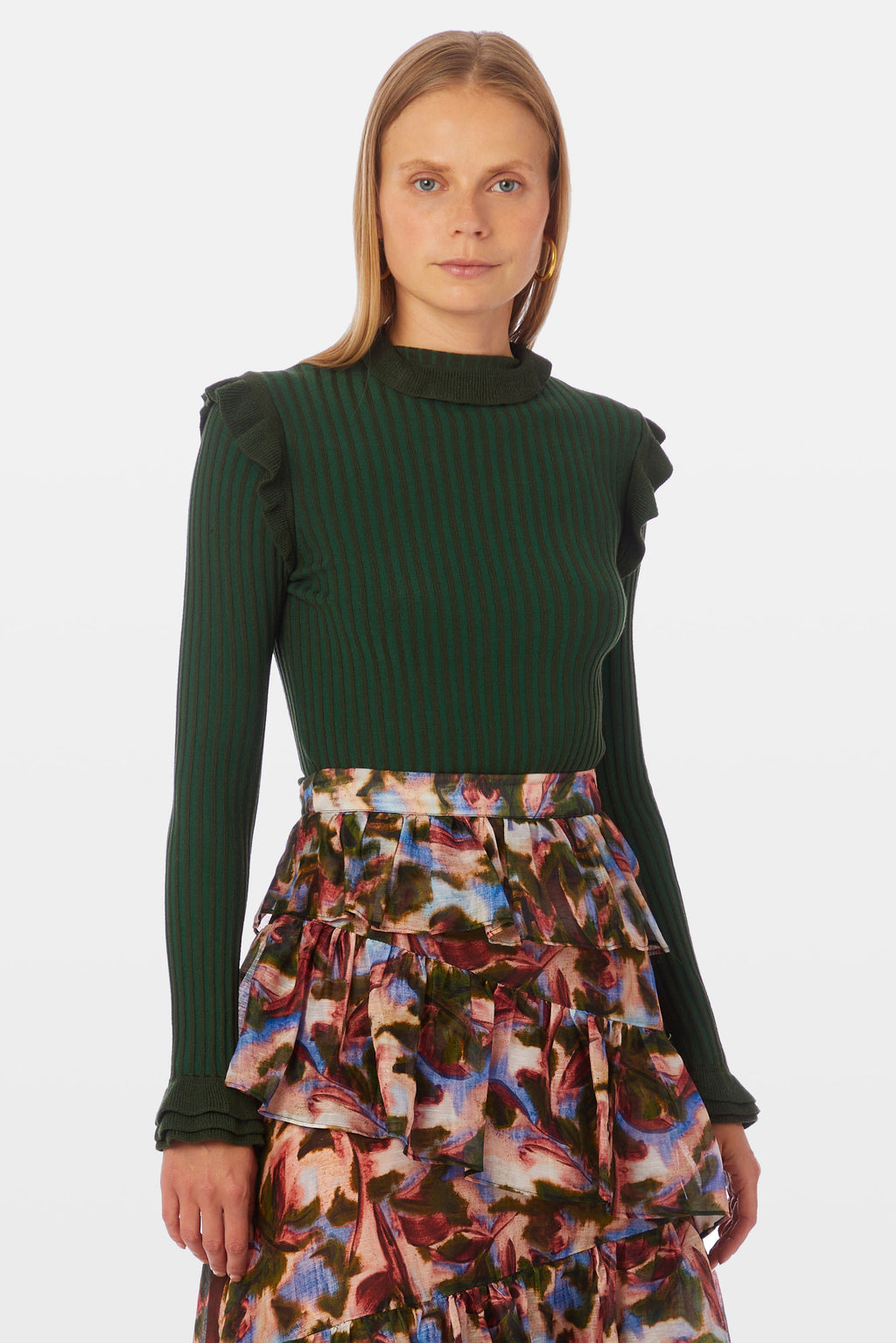 Green turtleneck with ruffle details on shoulders and neck