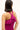 Bold pink body hugging knit tank with ruffled halter silhouette 