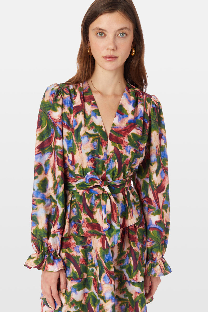 Long sleeve v-neck dress with elastic waist and optional tie belt in a multicolored abstract floral print