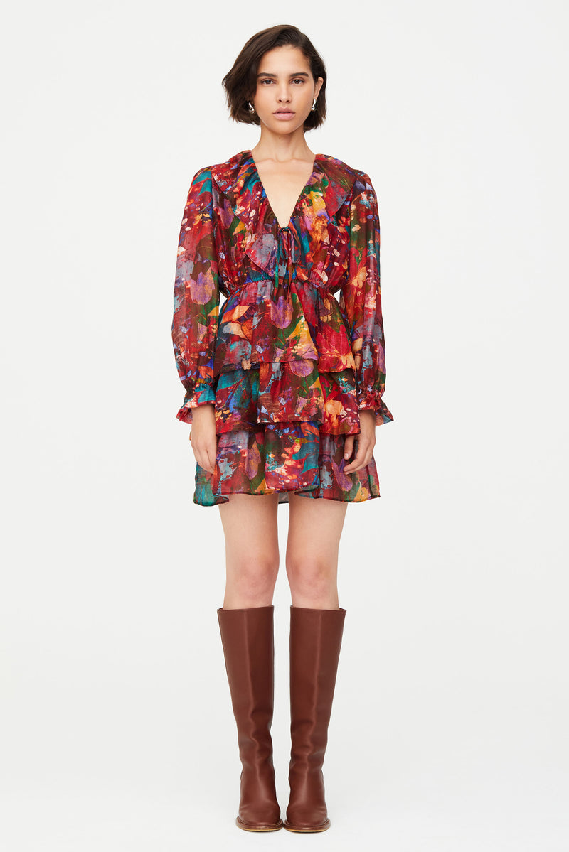Above the knee patterned dress with long sleeves and v neckline 