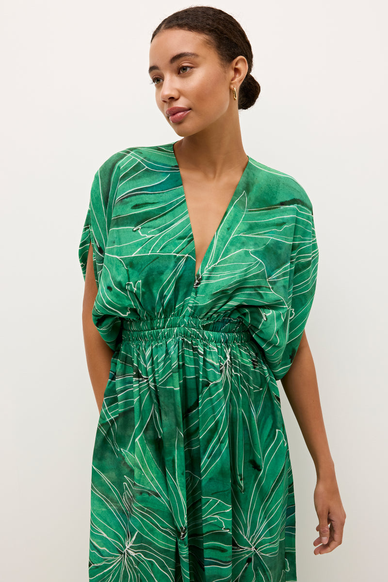 V neck tropical print dress in vibrant green with cinched waist detail 