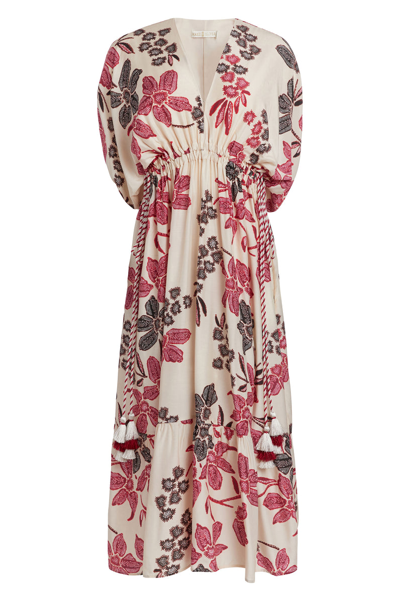 Midi dress in a pink and brown floral print that is cinched at the waist and has wide sleeves that stop at the elbow