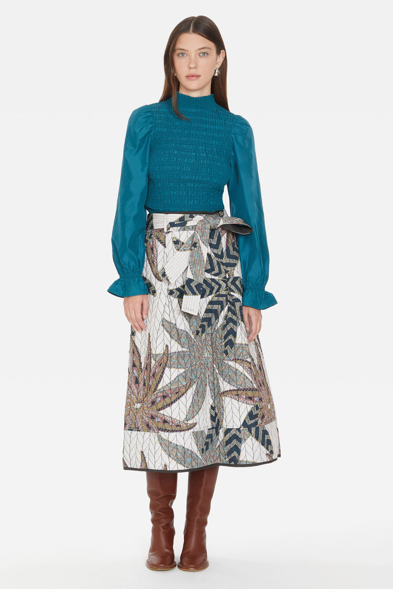 Midi length skirt with blue tone patterns and tie belt 