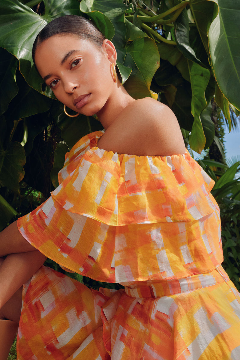 Off the shoulder top in a golden yellow checkered print