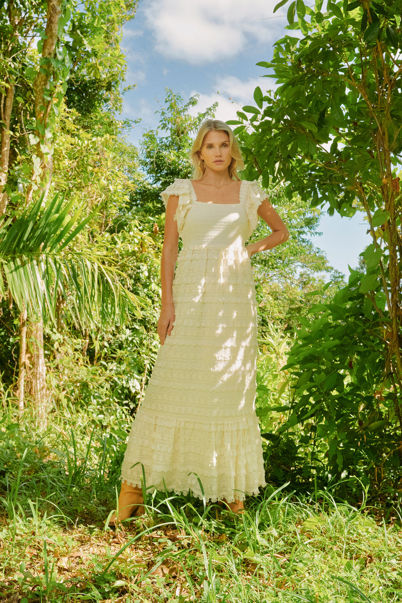 Maxi dress that has short flutter sleeves and a smocked bodice