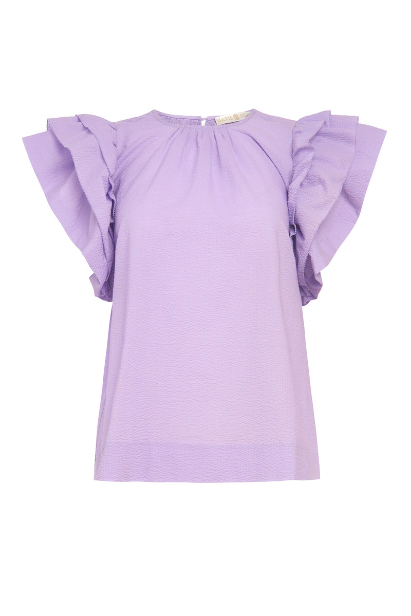 Short sleeve top with a rounded neckline in a light purple solid color in a dotted swiss fabric