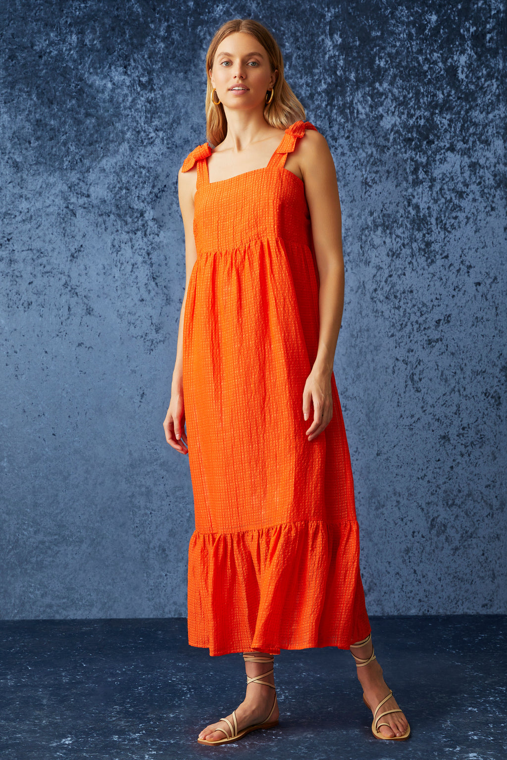Long dress that is cinched at the waist with long flowy silhouette