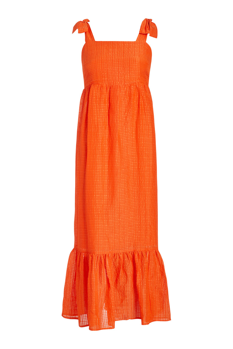 Flowy maxi dress with thick straps that tie at the shoulder in a orange solid color