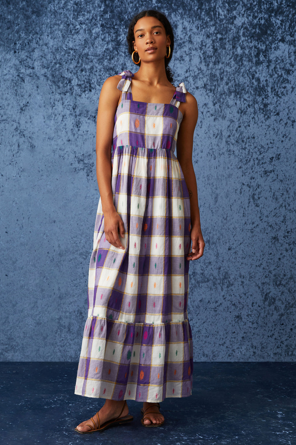 Long dress that is cinched at the waist with long flowy silhouette
