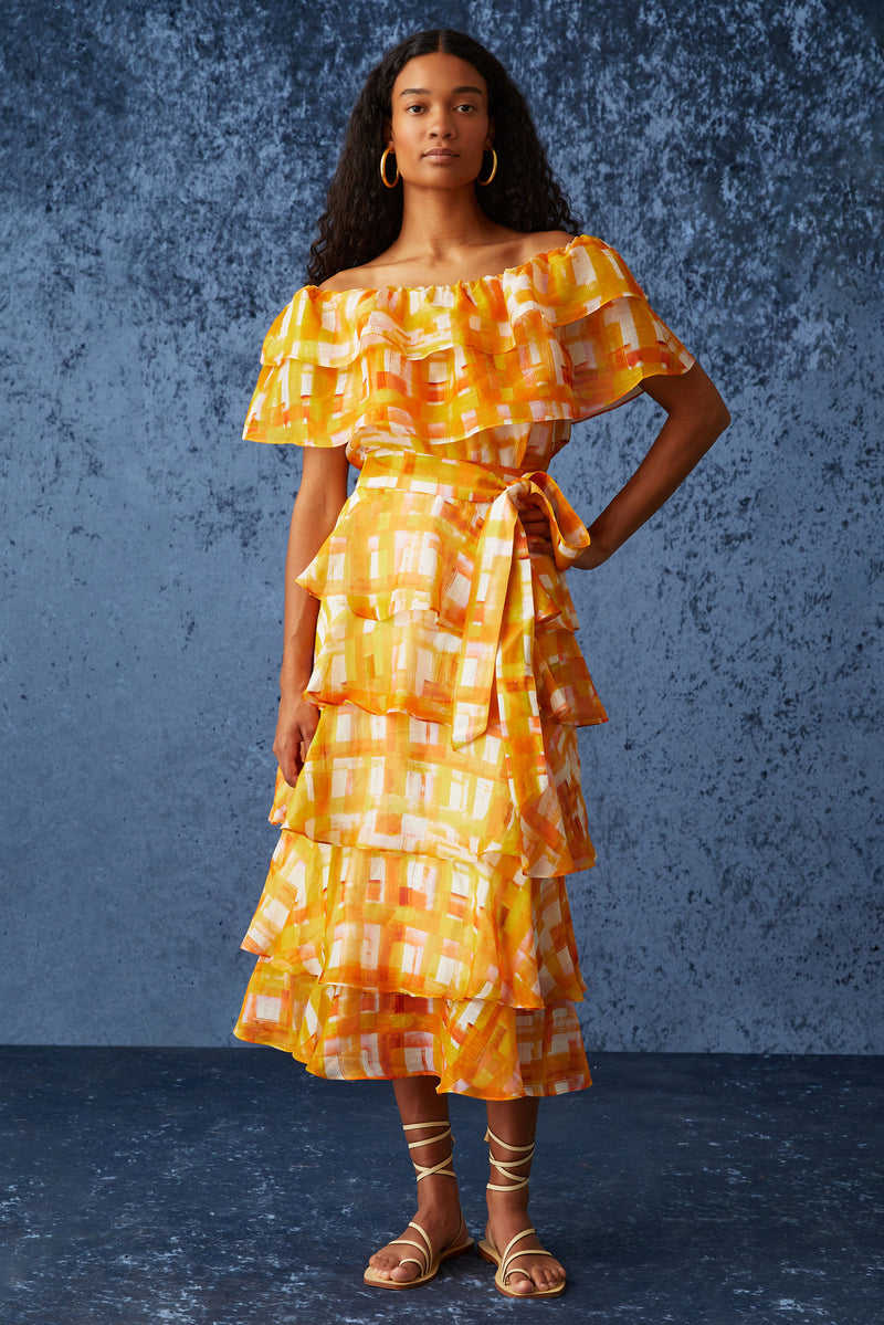 Long maxi skirt with tiered ruffles in a orange and yellow plaid print
