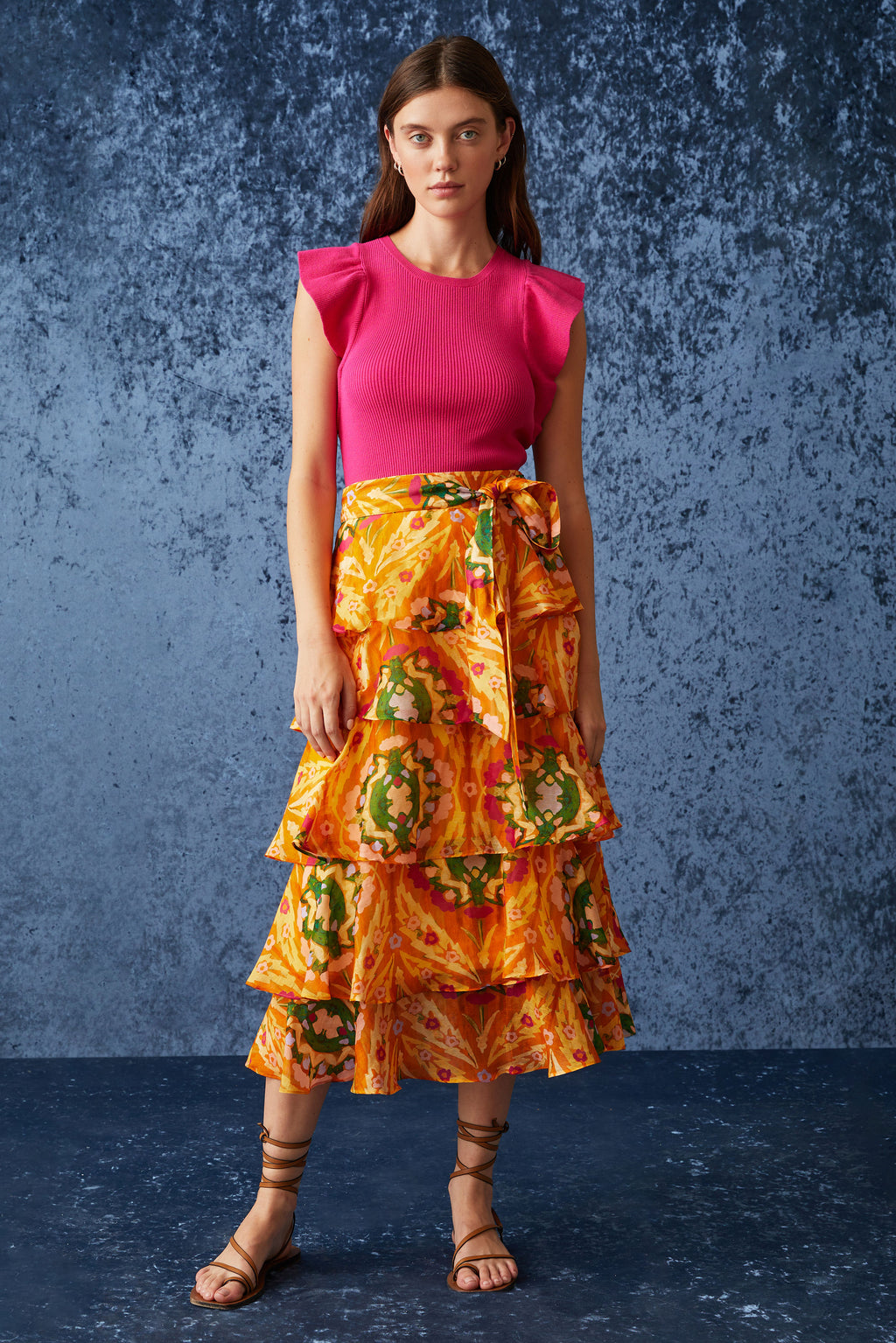 Long maxi skirt with tiered ruffles in a orange circular geometric print 