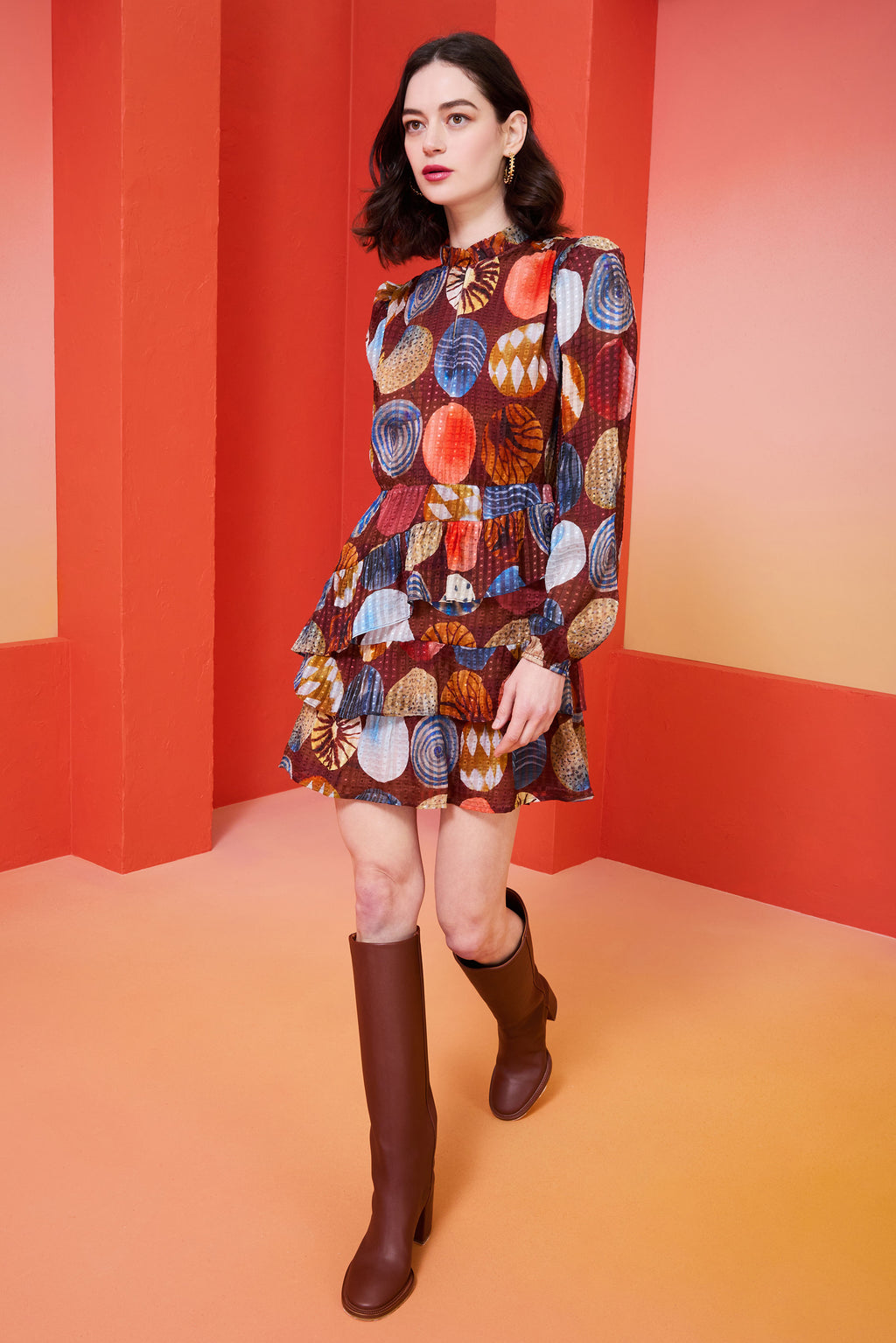 Long sleeve multi-colored dress with v-neck, tiered skirt, and a ruffled collar