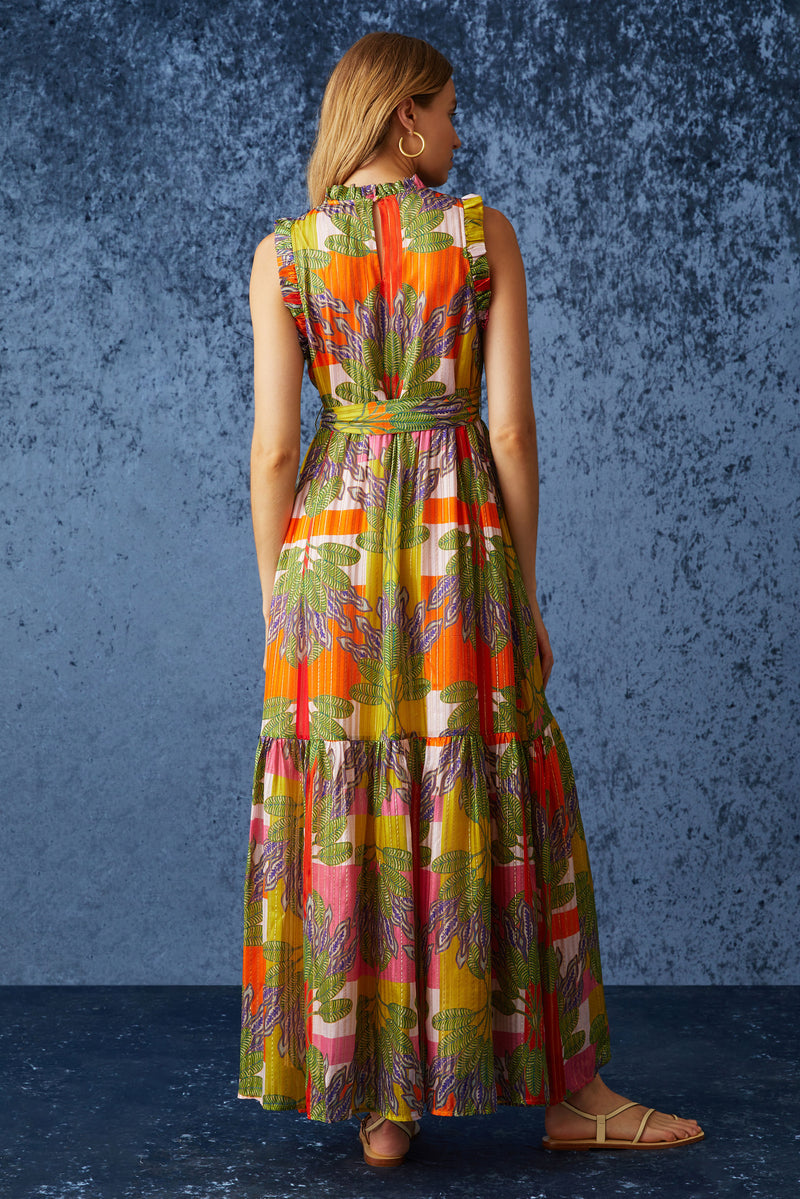 Maxi dress with delicate ruffle detailing at the sleeve and neckline with a sash belt at the waist