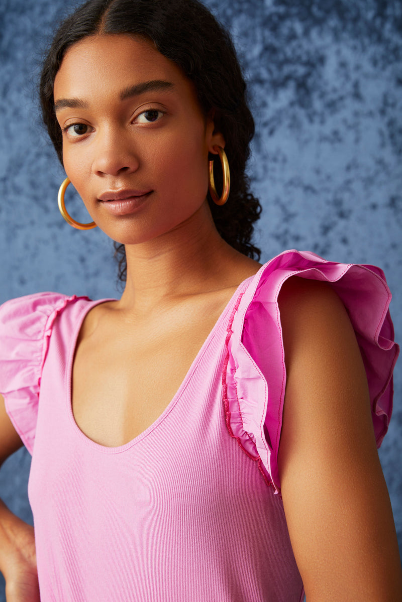 Scoop neck top with ruffled sleeves in a solid pink color