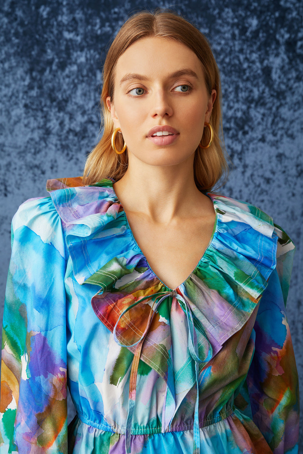 Long sleeve top with ruffled sleeves and a ruffled neckline