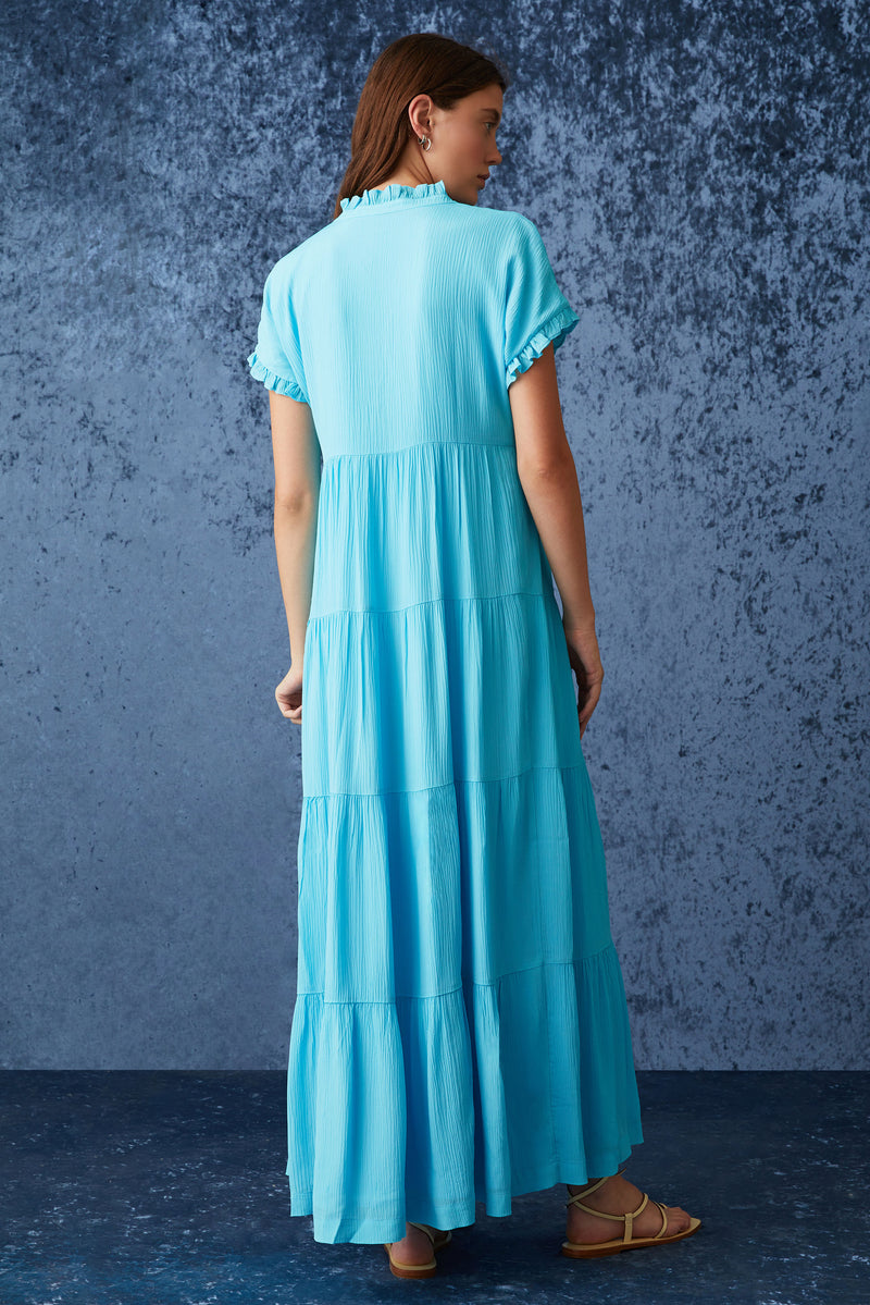 Blue solid four tiered maxi dress with an adjustable clasp neckline and short sleeves with delicate ruffles at the sleeves