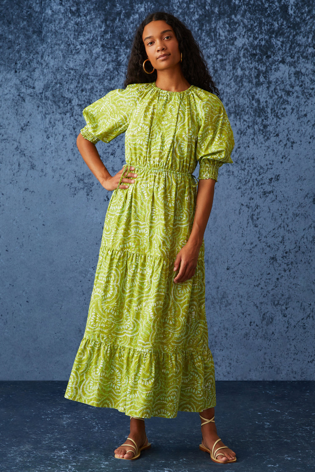 Bright green midi dress cinched at waist with puff sleeves