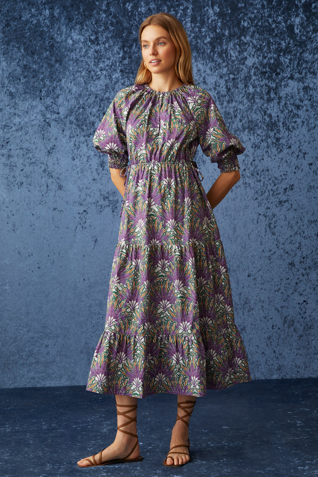 Bright green midi dress cinched at waist with puff sleeves