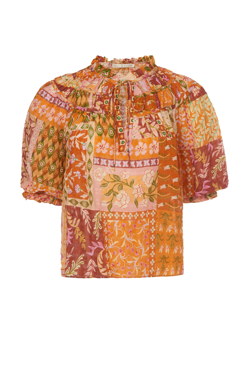 Top with an adjustable v-neckline and pleats around the collar 