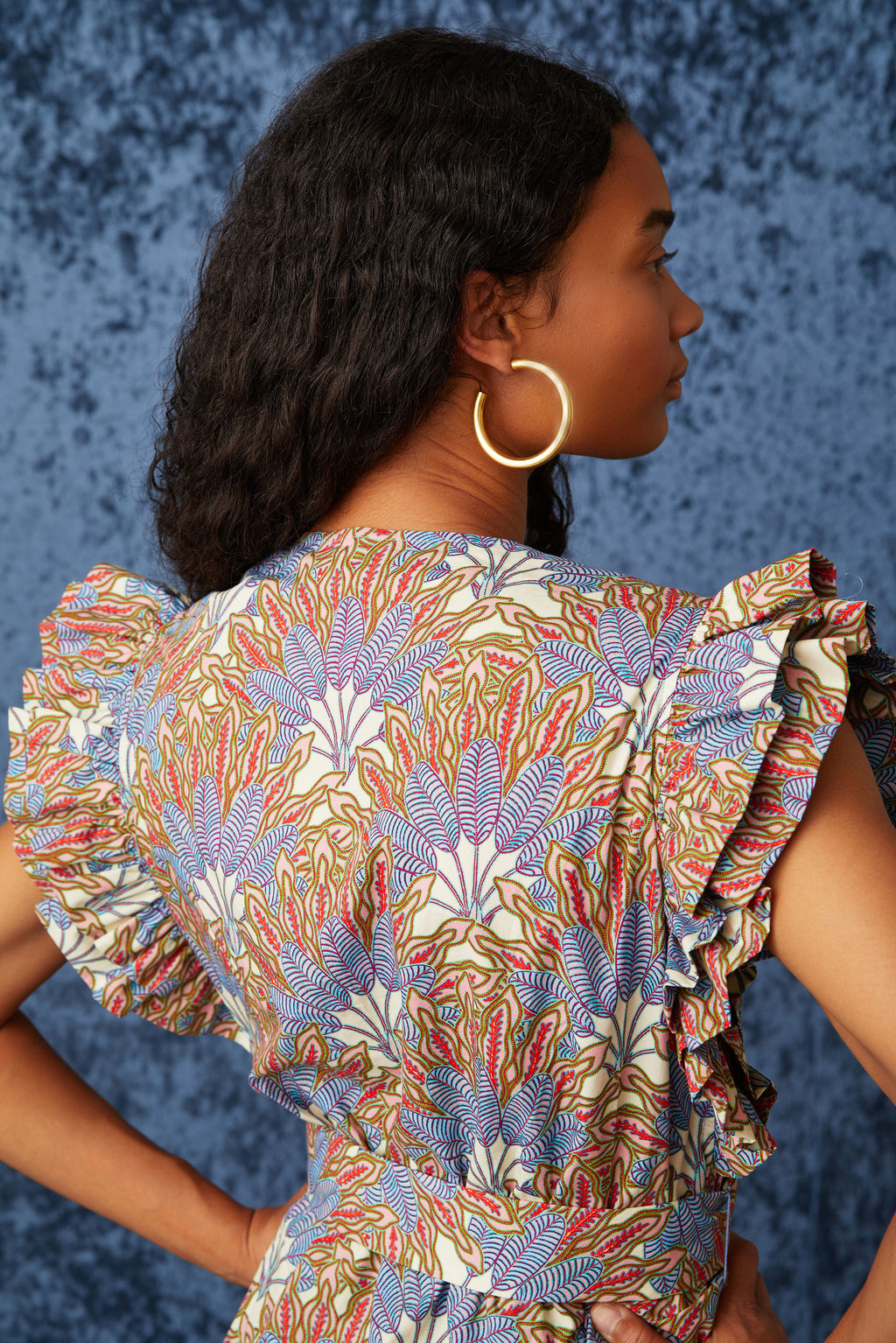 Blue and red floral printed dress with short ruffled sleeves and ruffled, tiered skirt