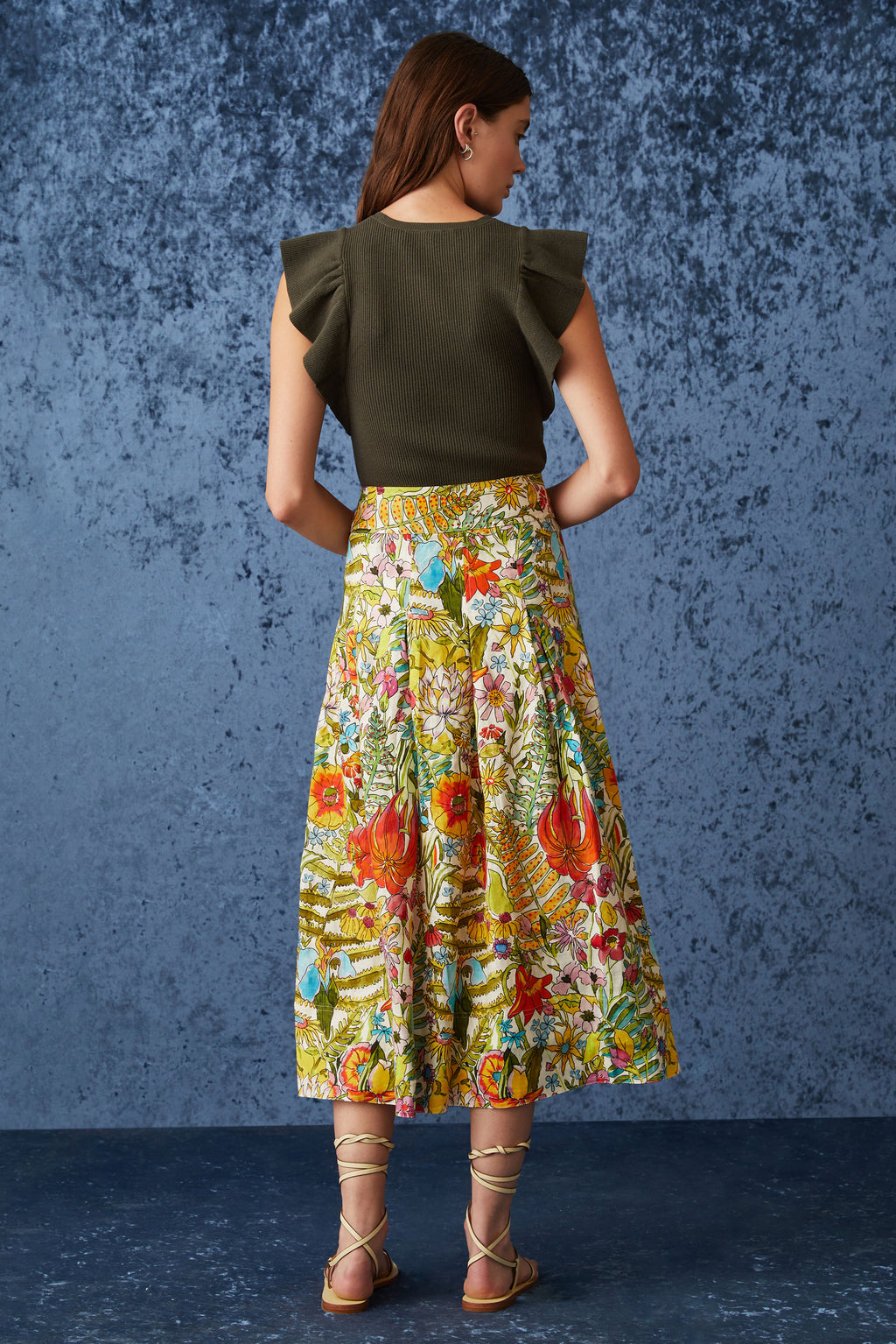 Straight skirt with large pleats throughout in a large multicolor floral print