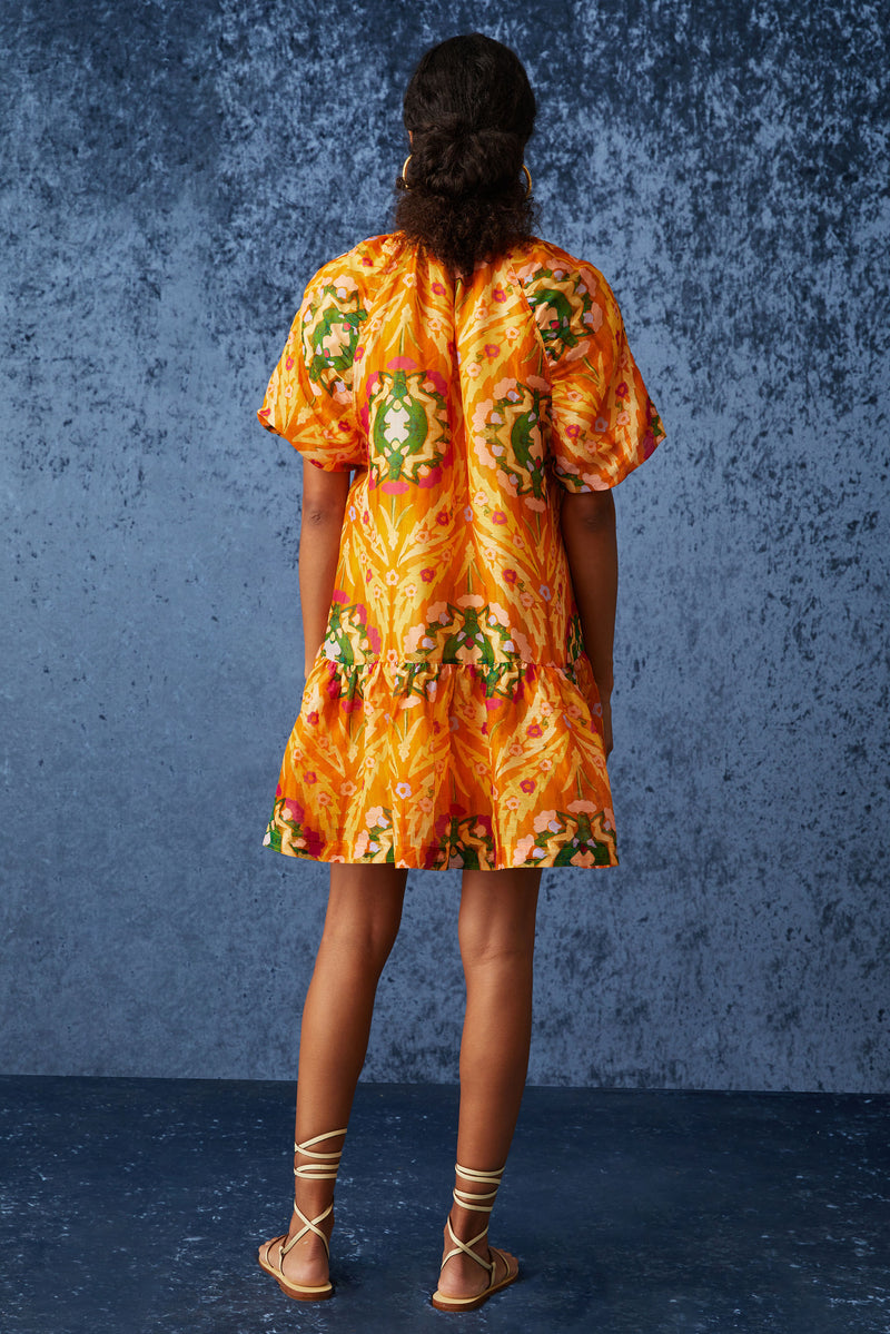 Mini dress in a bright orange print with a flowy slip on silhouette 