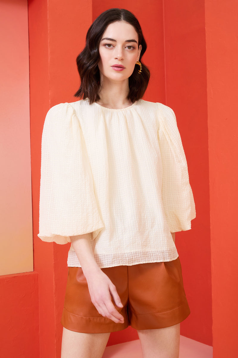 soft off-white top with three quarter paper bag sleeves