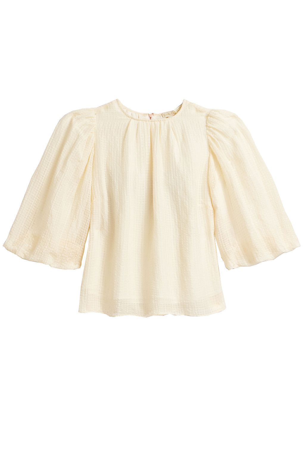 full sleeve top in an off-white fabric with an exposed rose gold zipper in the back
