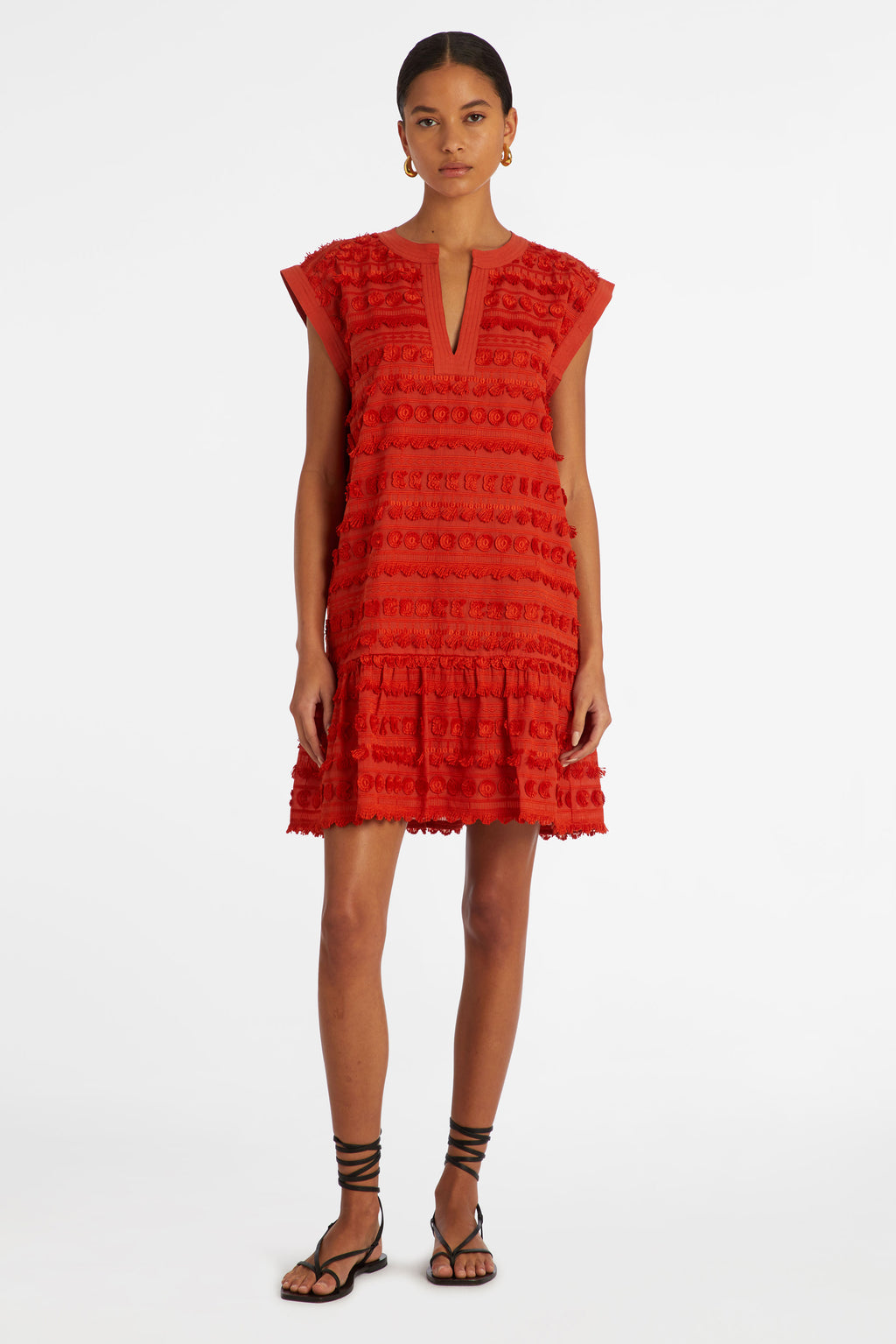 Solid red short dress with short tassels to form the pattern 