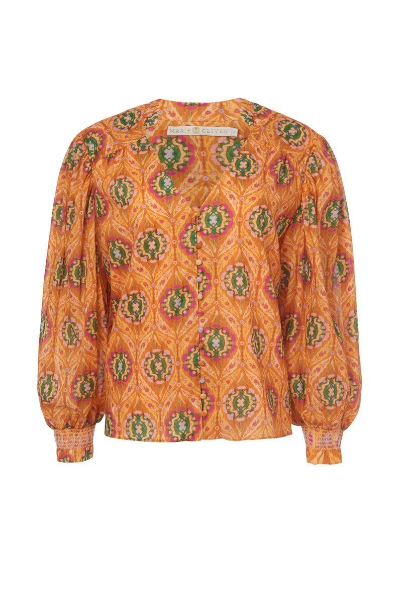 Orange geometric printed blouse with long sleeves, gathers at the shoulder, and a straight silhouette