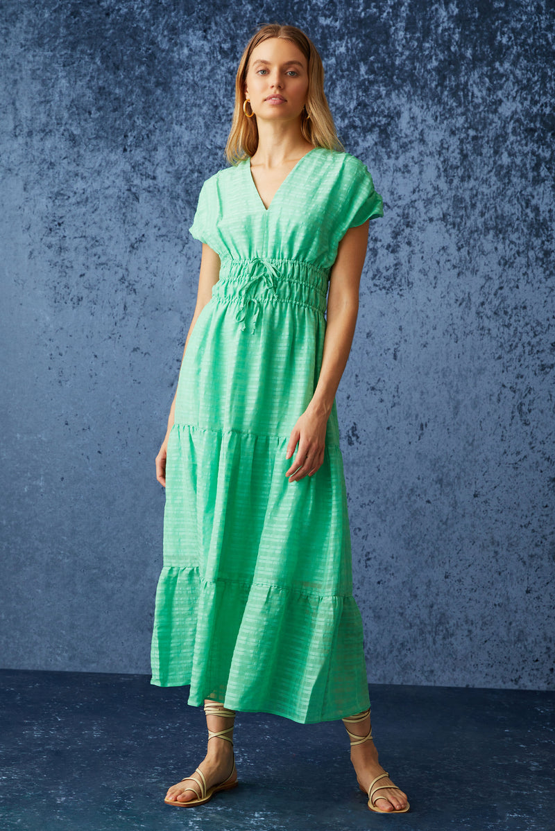 Long dress that has short cap sleeves and an adjustable cinched waist