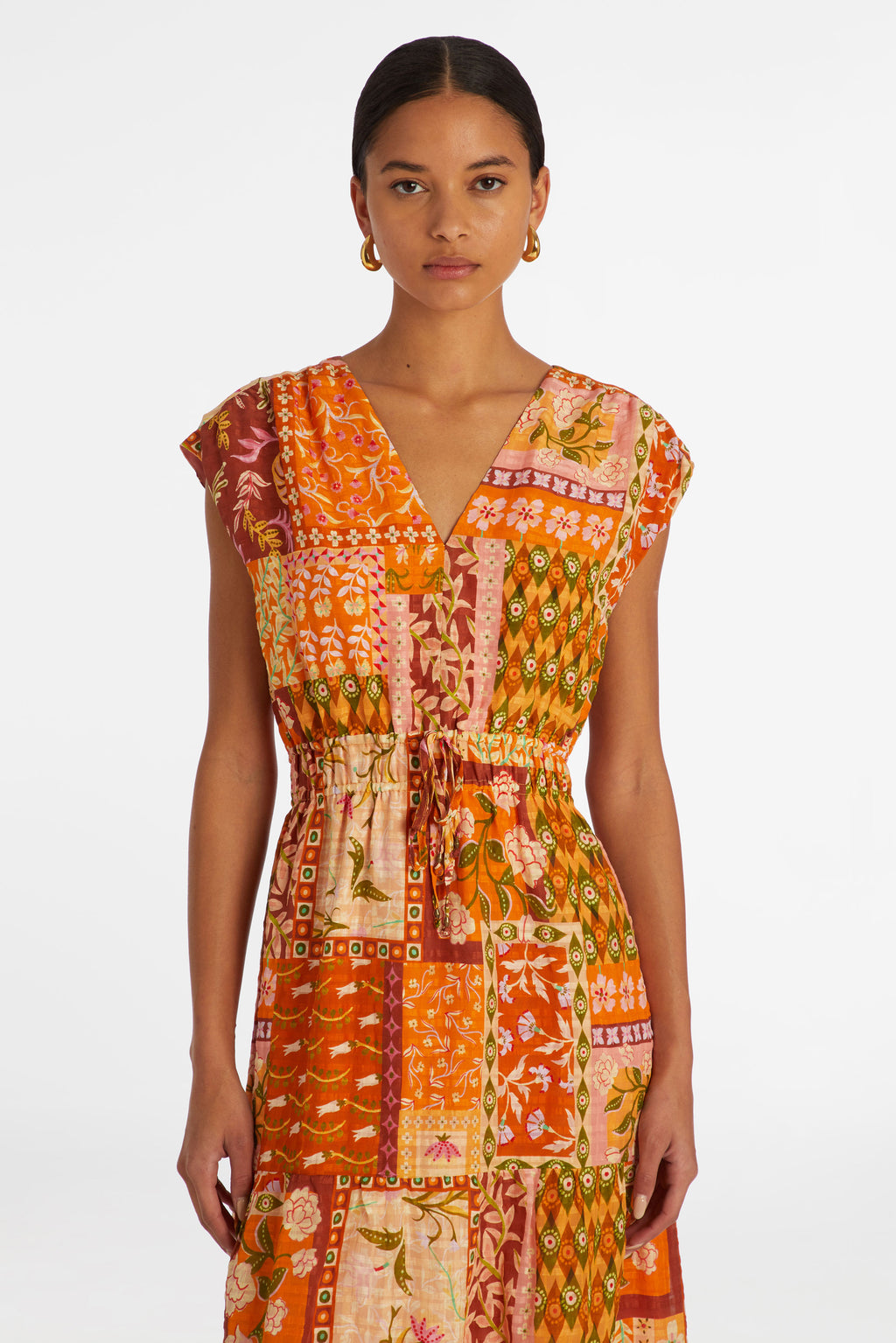 Long dress that has short cap sleeves and an adjustable cinched waist