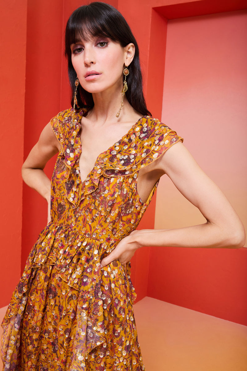 Floral long dress with a ruffle v-neck in the front and back and a tie closure at the back of the neck