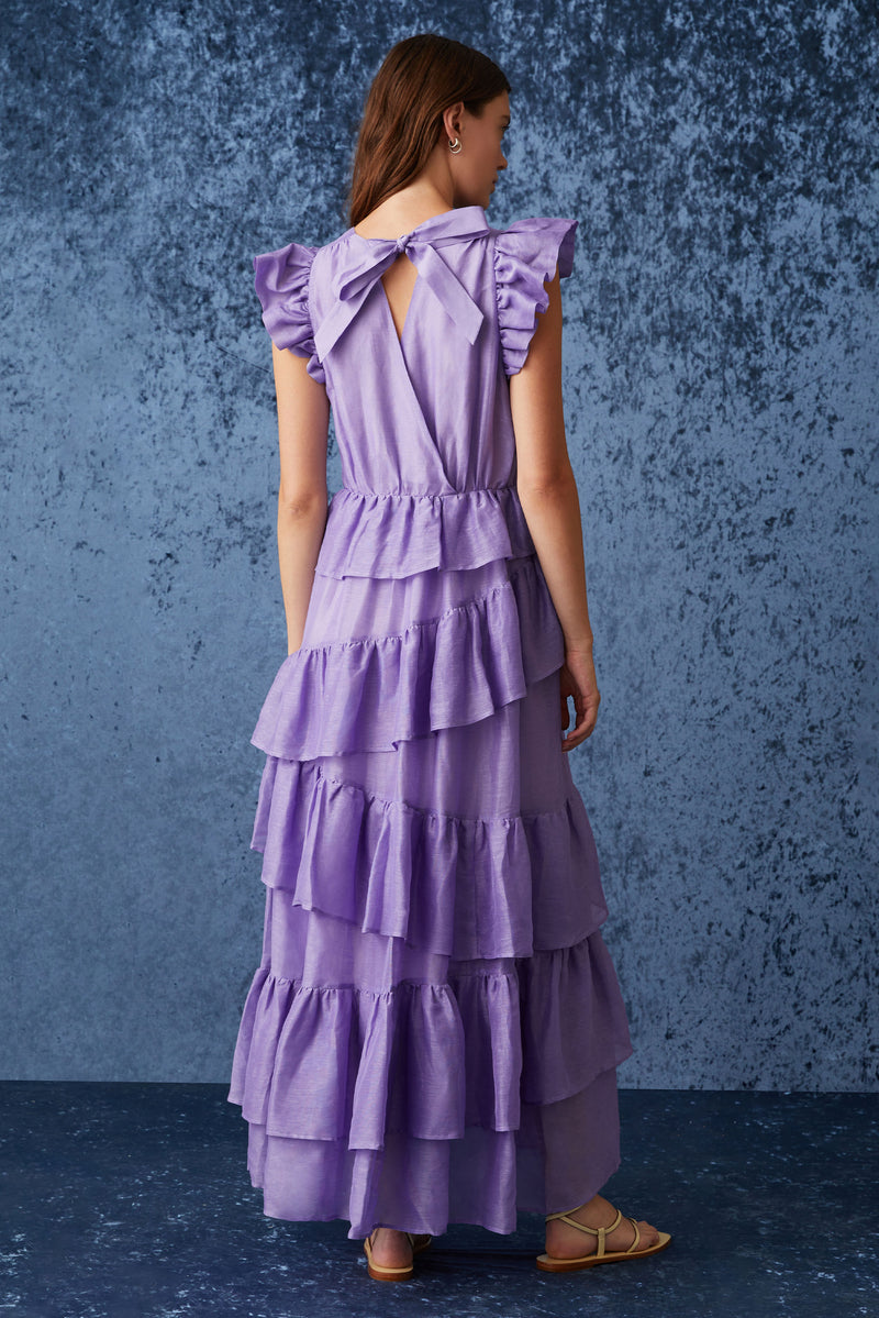 Solid purple maxi dress that is cinched at the waist with an asymmetrical ruffled tiered skirt 
