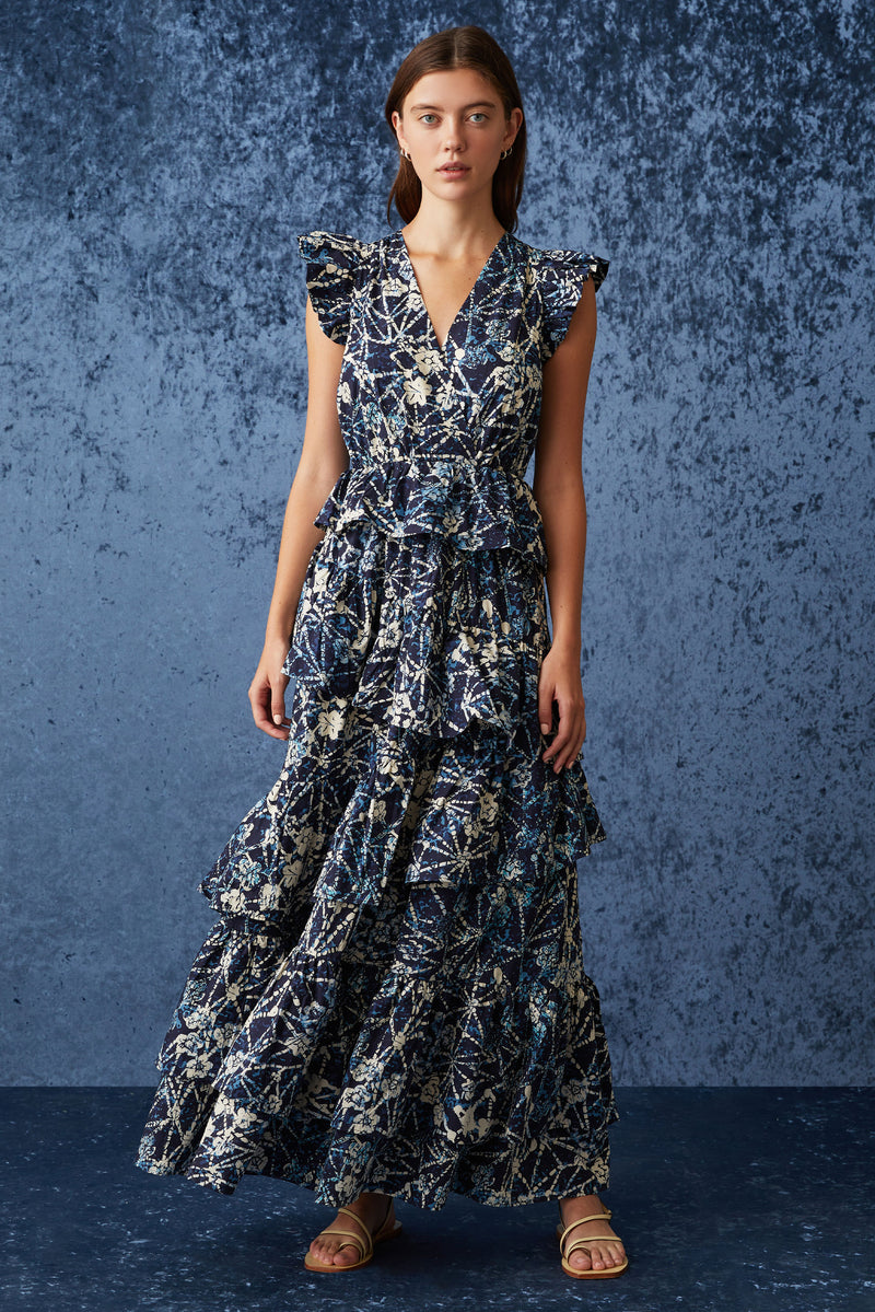 Long dress with deep v-neckline that is cinched at the waist