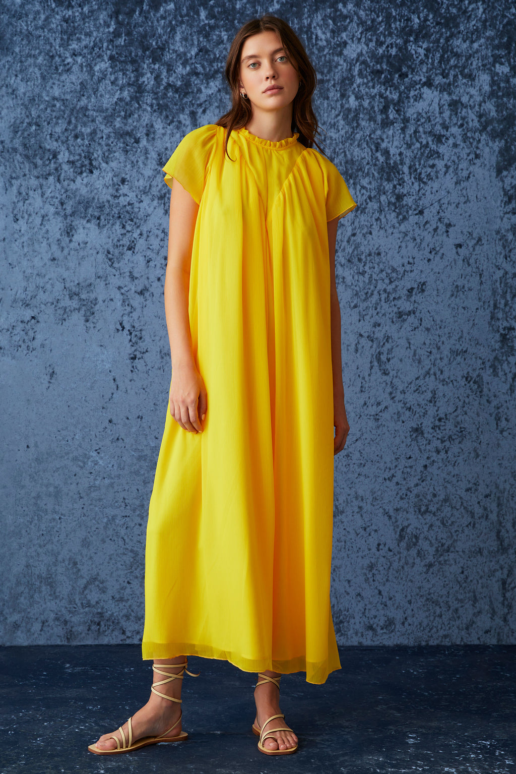 Golden yellow maxi dress with a straight silhouette and short sheer sleeves