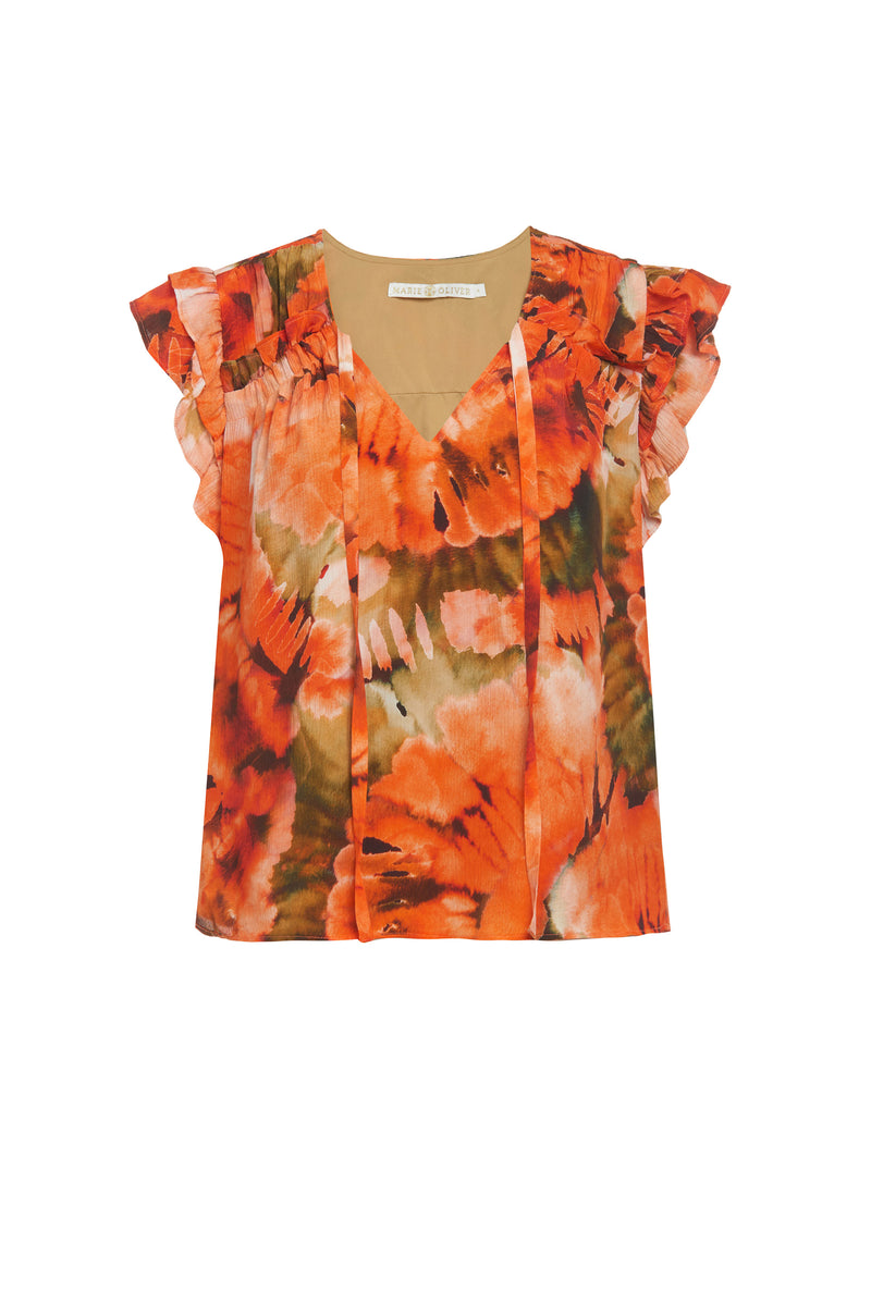 Short sleeve shirt with large orange flowers, two tiered ruffle sleeves, and ruffles going across the chest