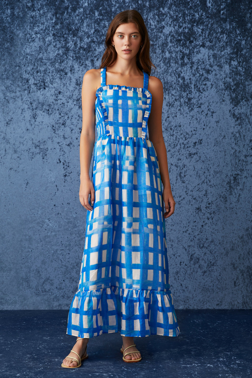 Midi dress that is cinched at the waist with straps that cross over in the back and square neckline